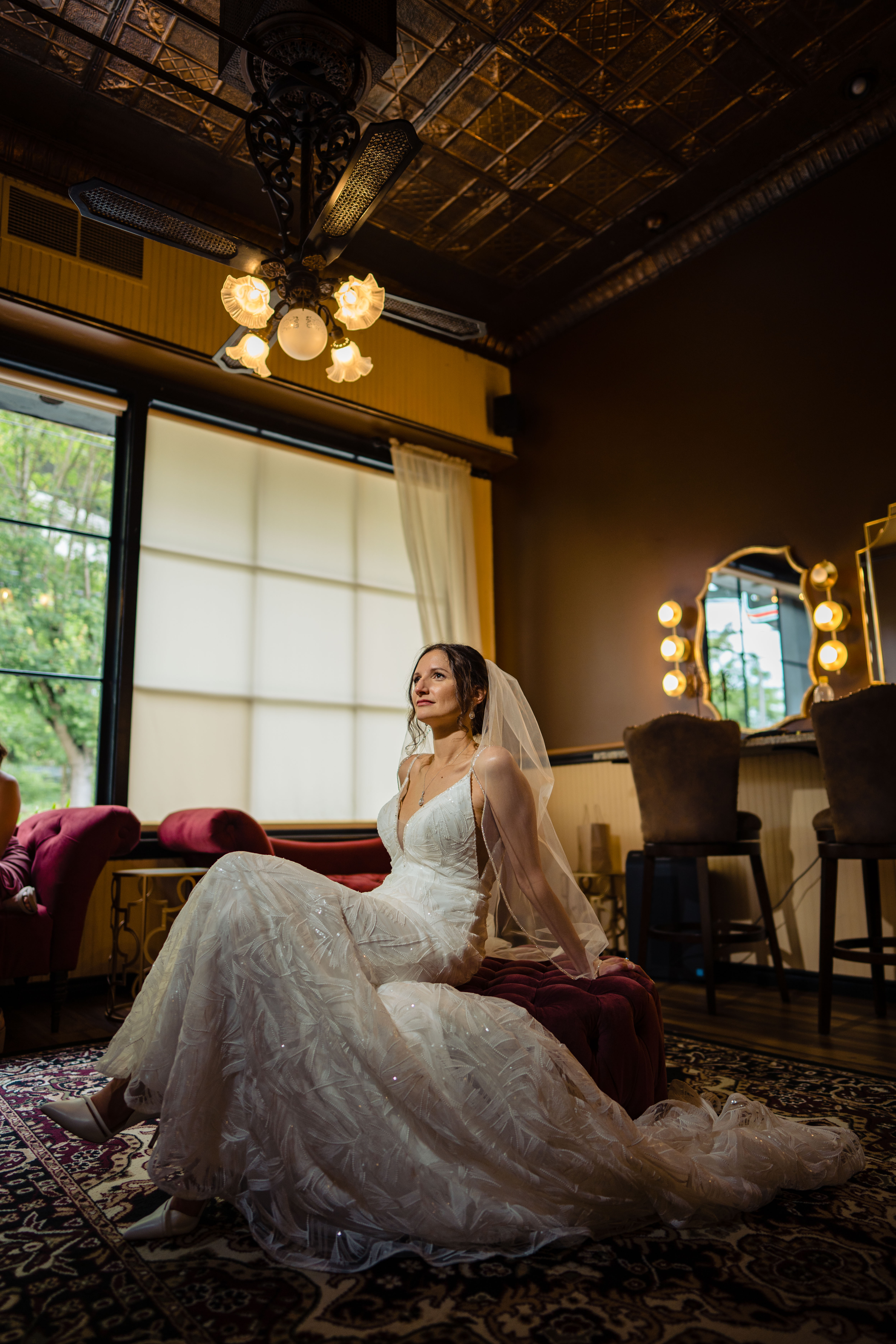 A bride posing for a photo in the Cadence Suite