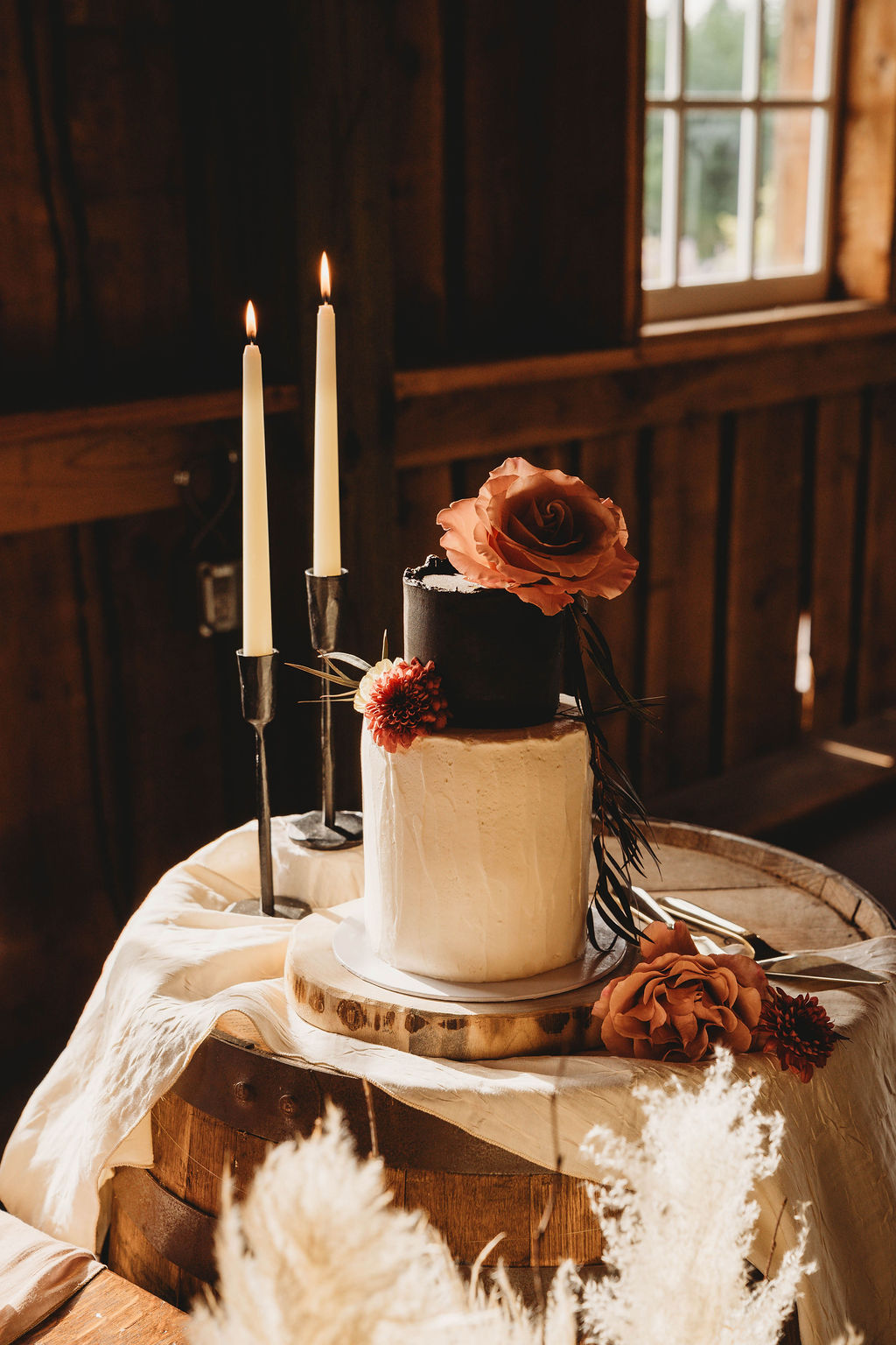 Hillside Farms Tenino black and white wedding cake with blush roses