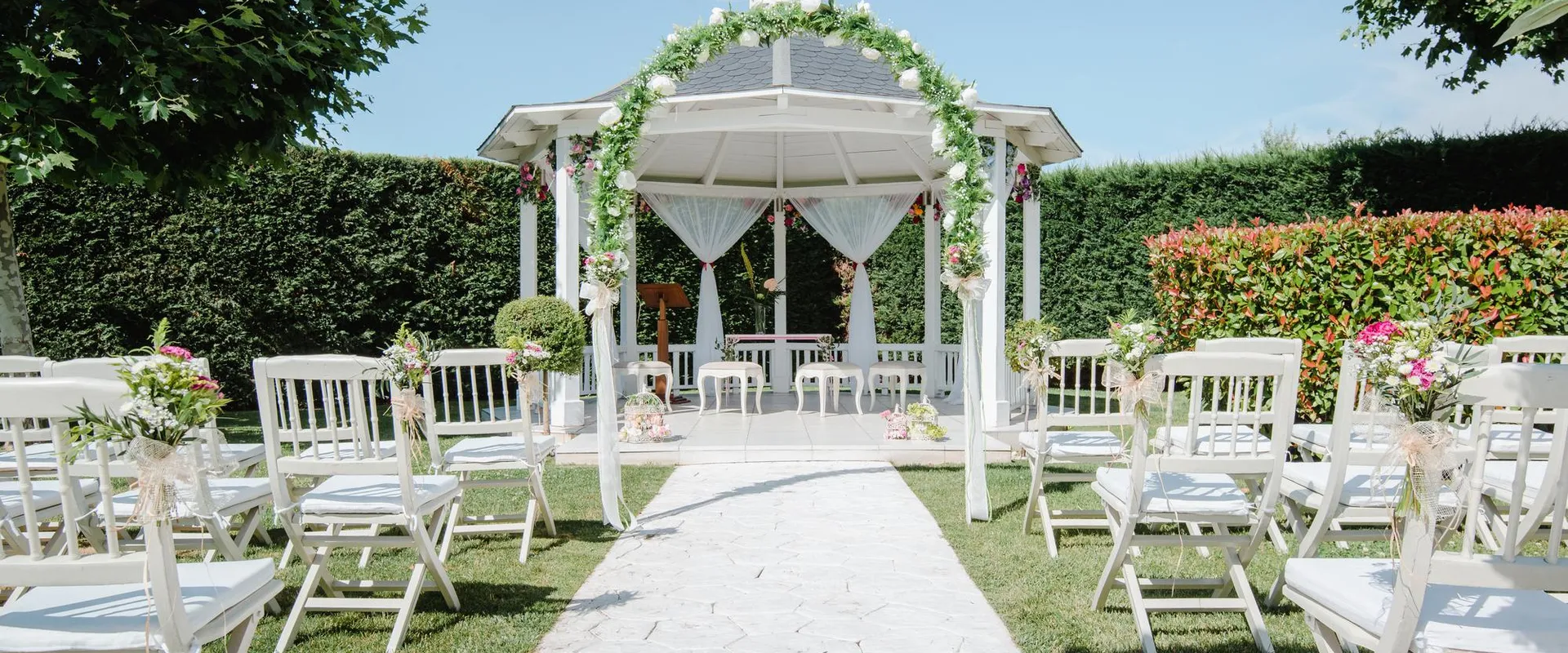 beautiful outdoor wedding venu with white gazebo