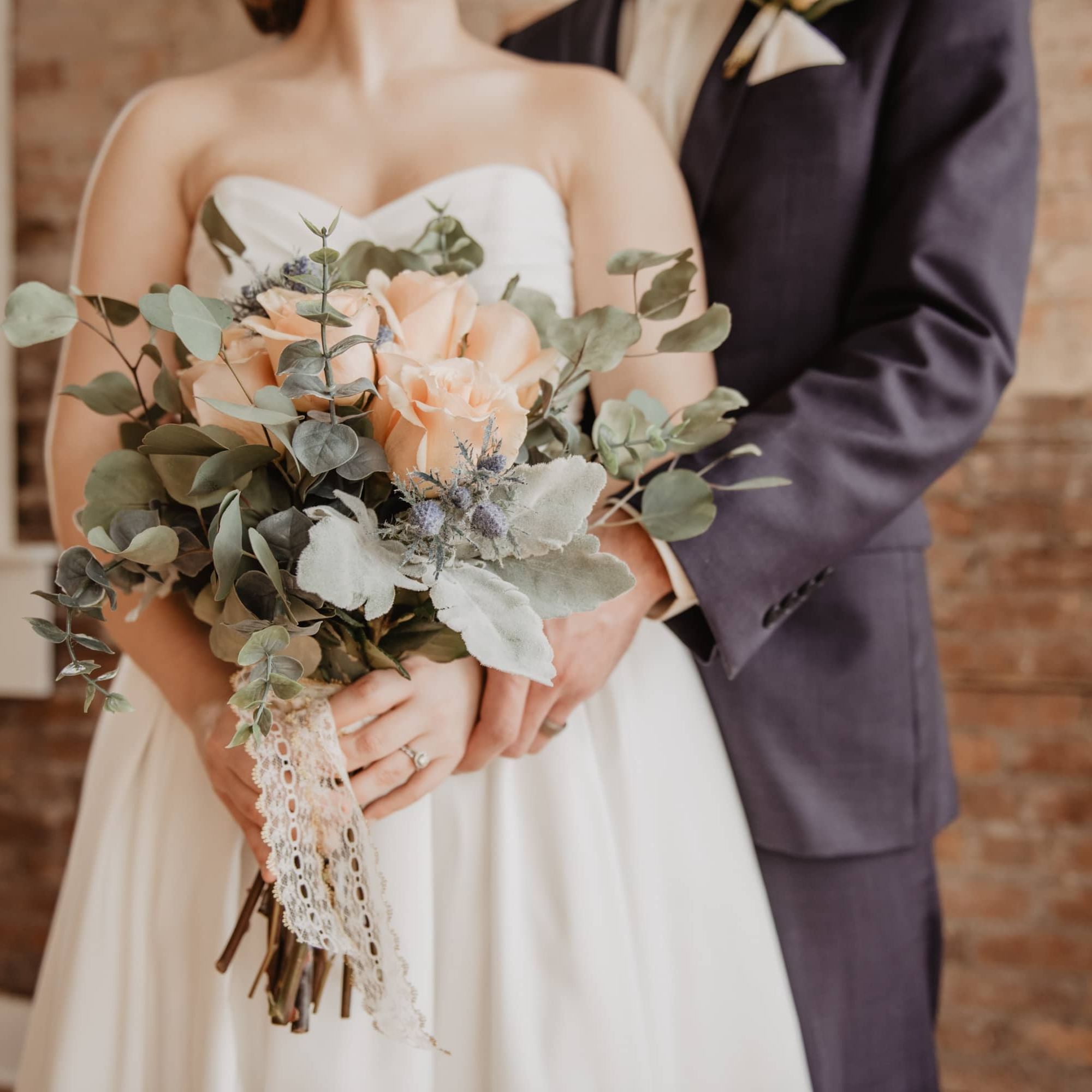 bride and groom holding each other