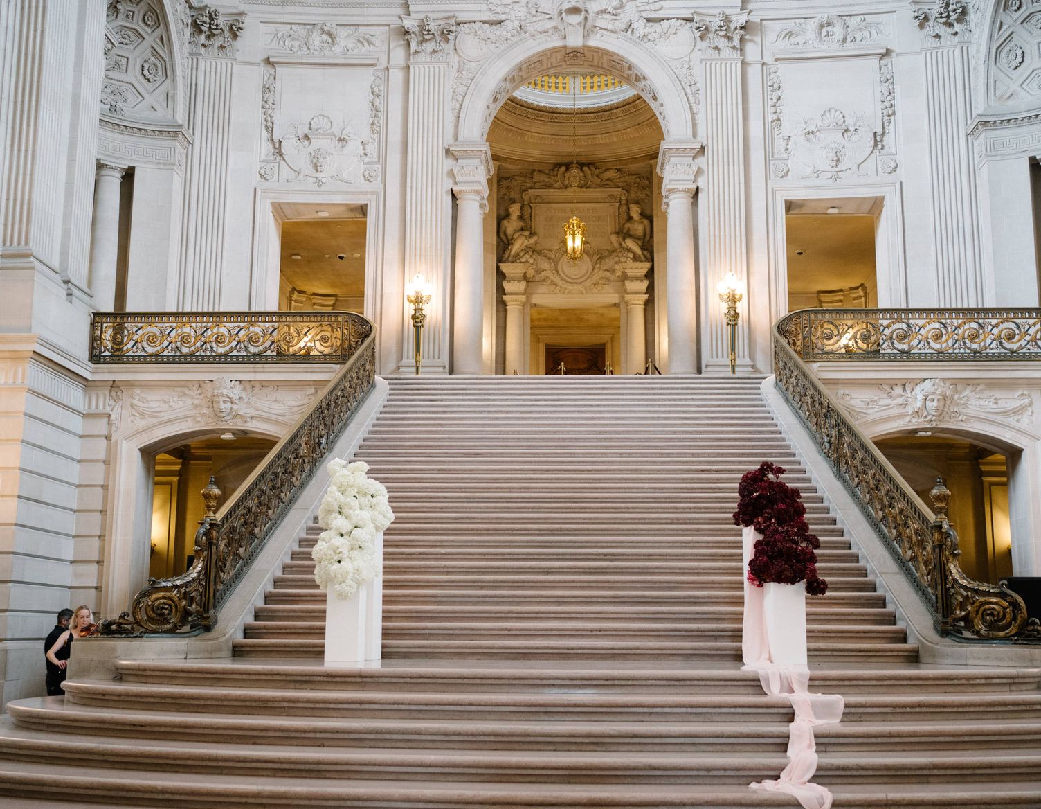 a candle neatly arranged with flowers
